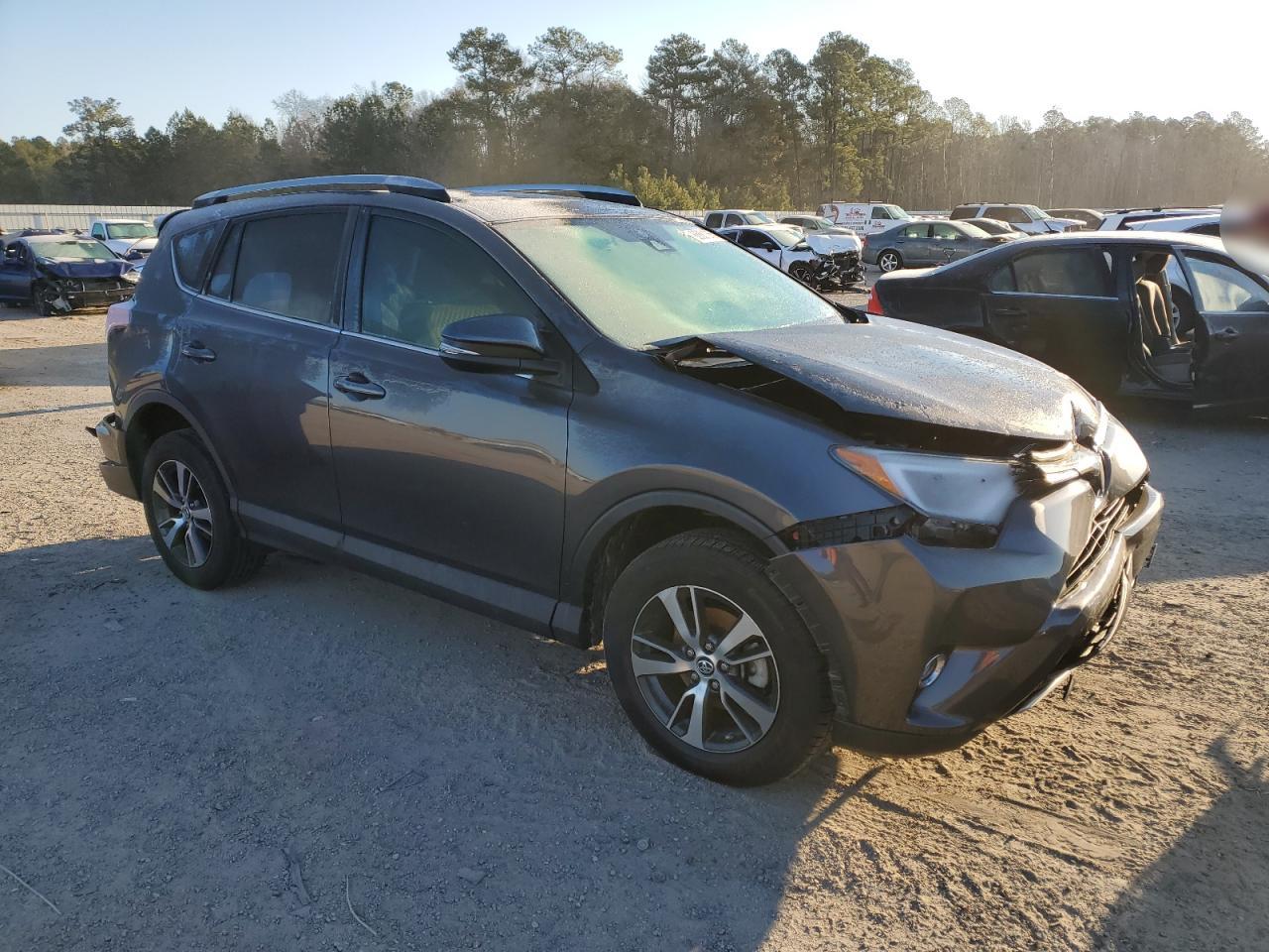 2018 Toyota RAV 4 VIN 2T3WFREV6JW433840 Copart auction photo, rear end / front end damage thumbnail 4