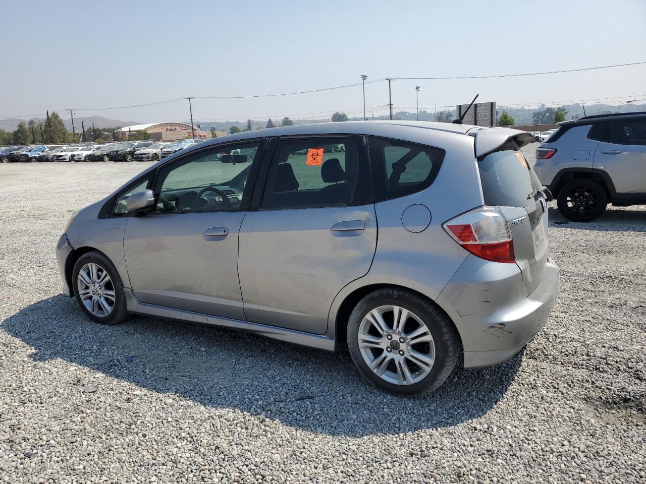 2010 Honda Fit VIN JHMGE8H64AS012521 Copart auction photo, side / front end damage thumbnail 2