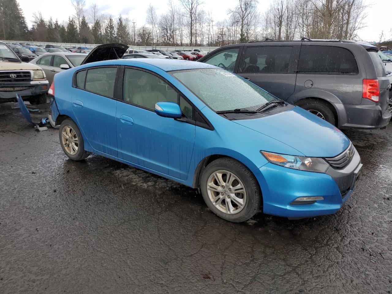 2010 Honda Insight VIN JHMZE2H76AS006573 Copart auction photo, rear end damage thumbnail 4