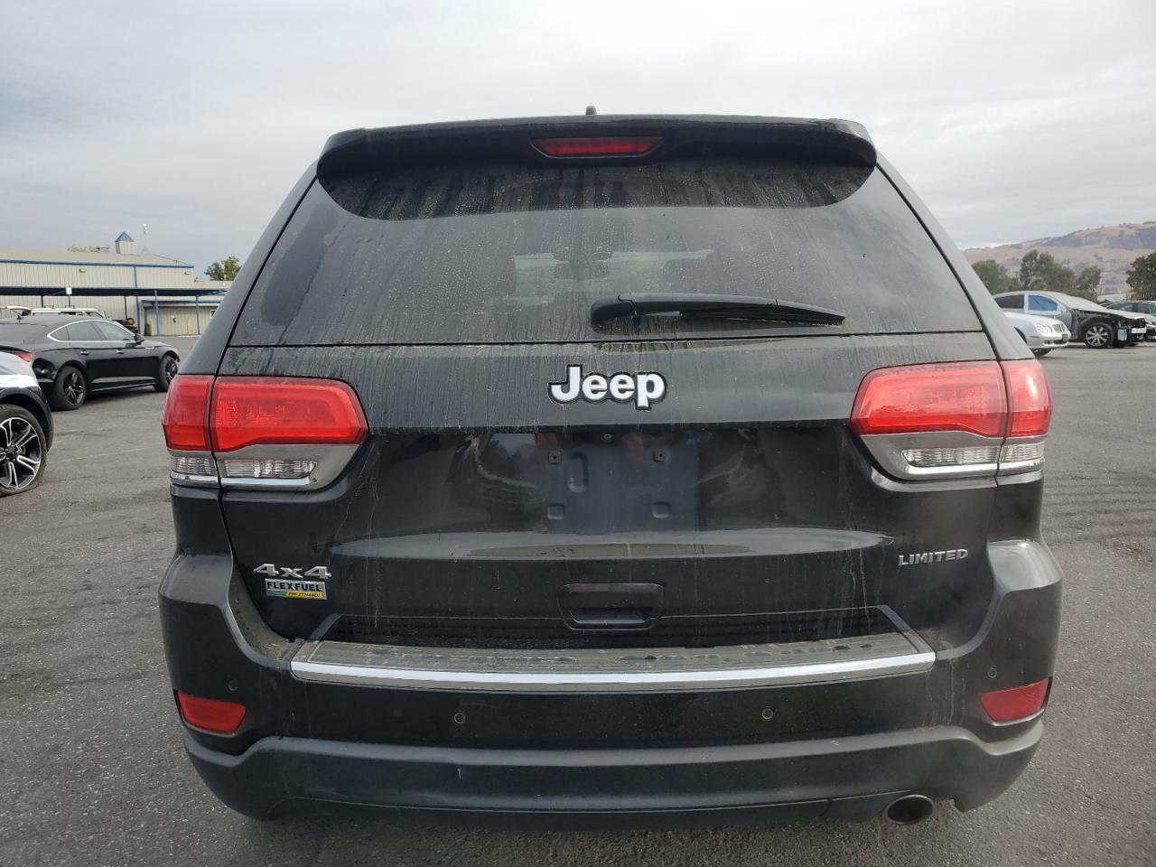 2015 Jeep Grand Cherokee VIN 1C4RJFBGXFC830557 Copart auction photo, side / front end damage thumbnail 6