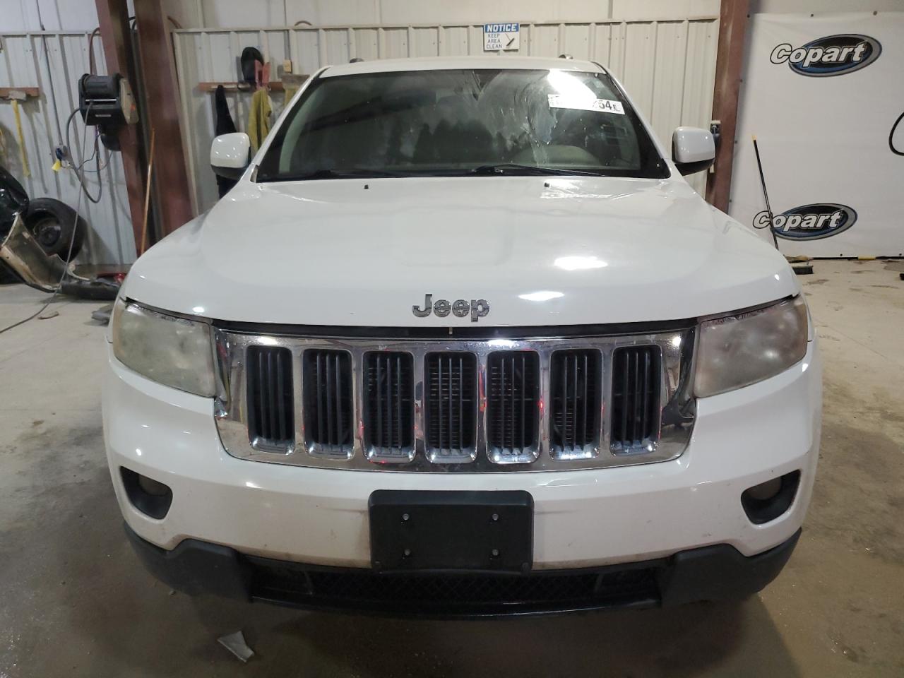 2012 Jeep Grand Cherokee VIN 1C4RJEAG9CC290707 Copart auction photo, rear end / minor dent/scratches damage thumbnail 5