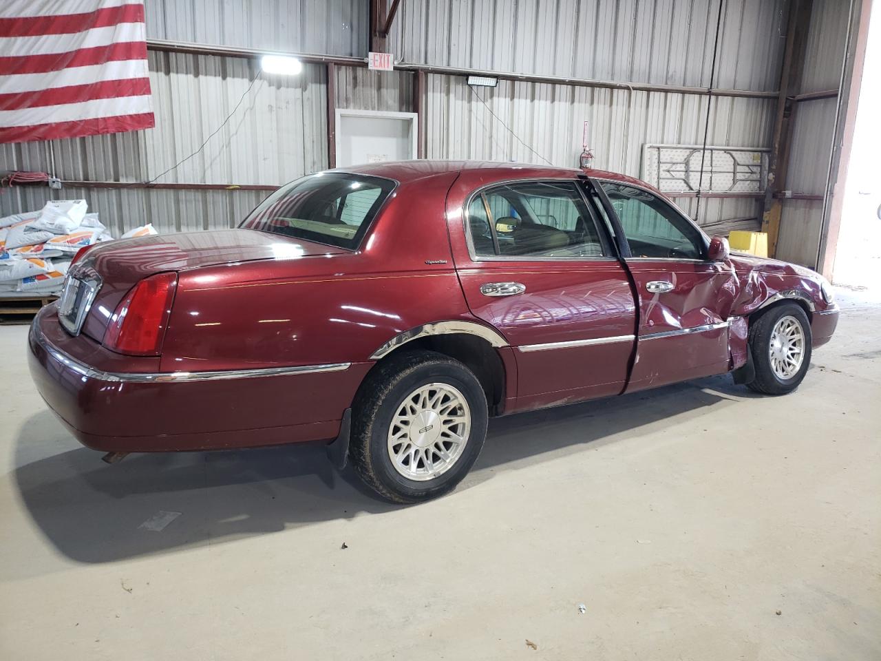 1999 Lincoln Town Car VIN 1LNHM82W6XY616896 Copart auction photo, front end / side damage thumbnail 3