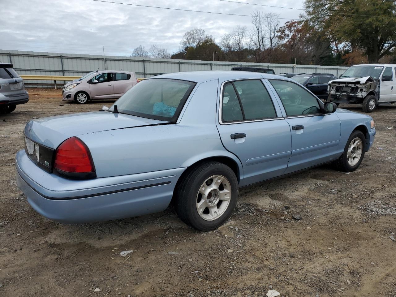 2001 Ford Crown Victoria VIN 2FAFP71W61X161009 Copart auction photo, side / front end damage thumbnail 3