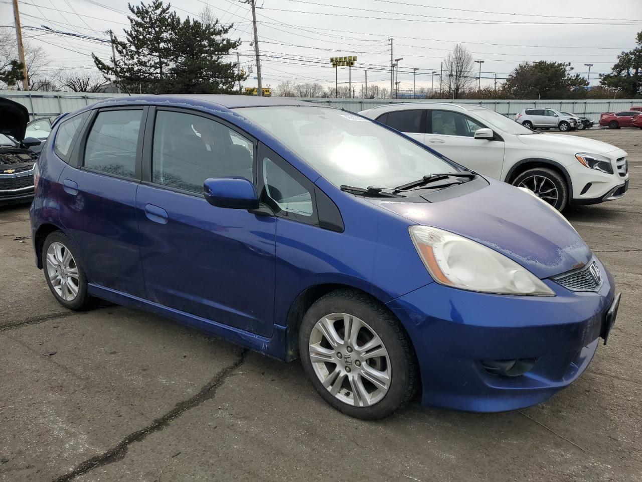 2009 Honda Fit VIN JHMGE87469S011740 Copart auction photo, side damage thumbnail 4
