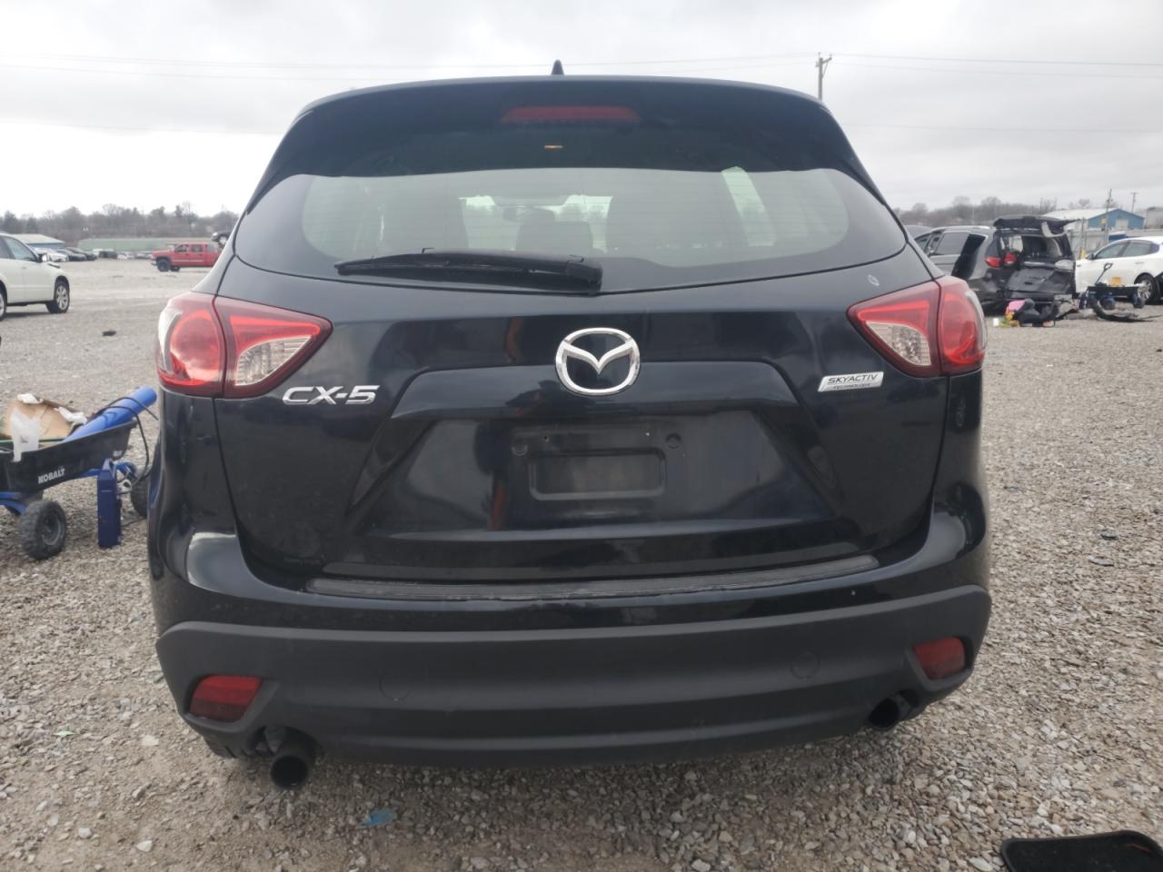 2014 Mazda CX-5 VIN JM3KE2BE4E0308818 Copart auction photo, side / rear end damage thumbnail 6
