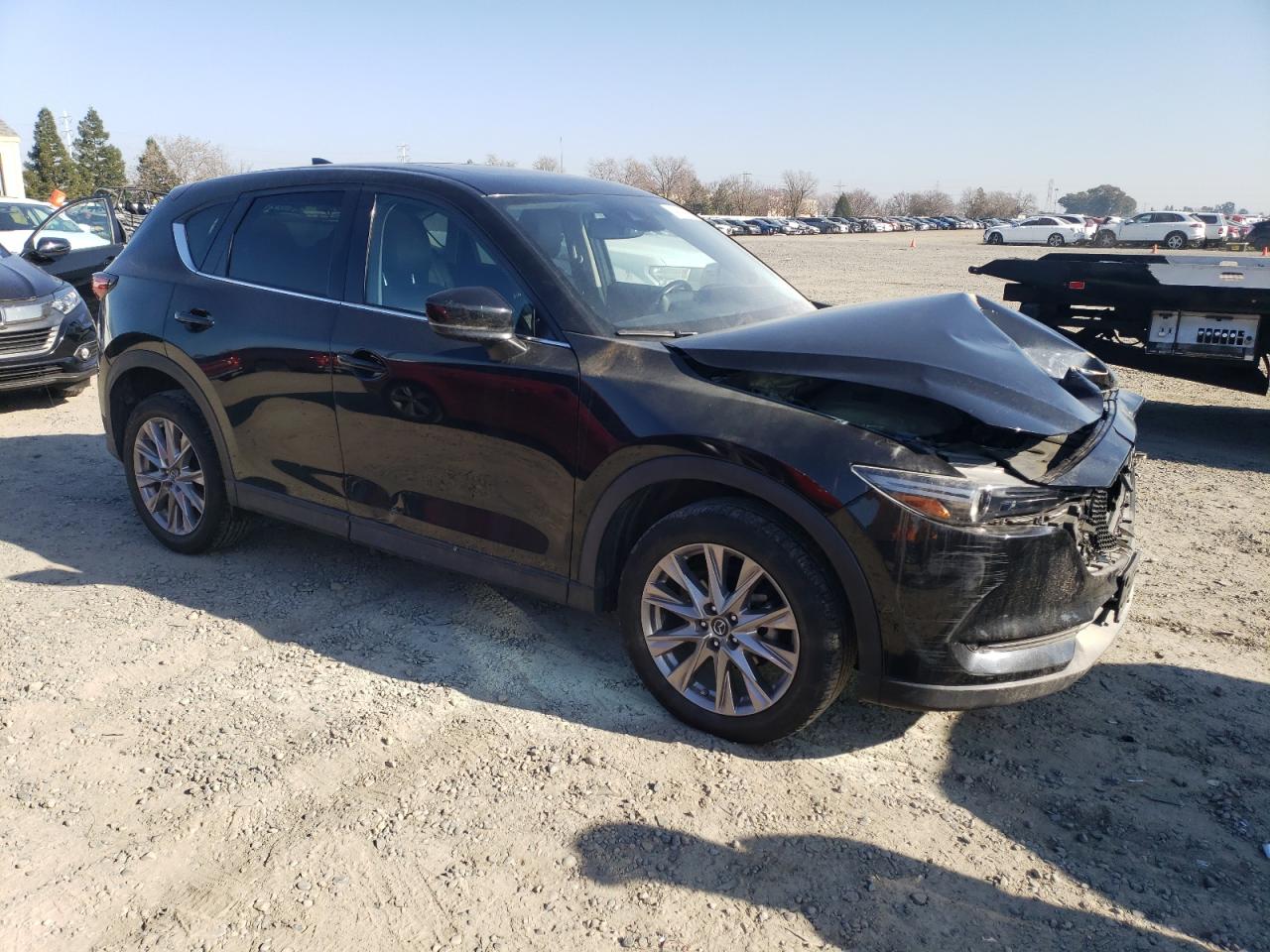 2019 Mazda CX-5 VIN JM3KFADM2K0550207 Copart auction photo, front end / burn - engine damage thumbnail 4