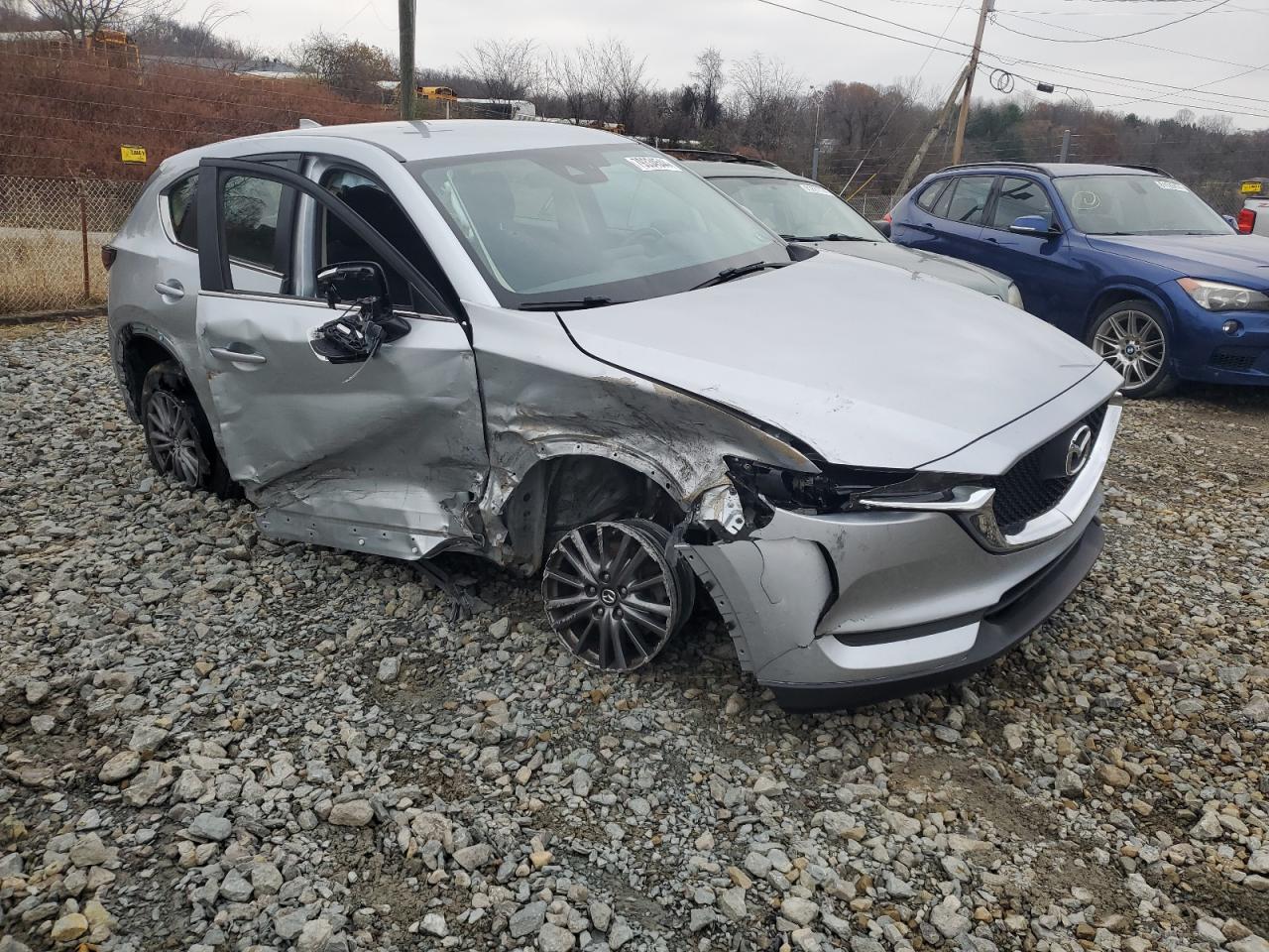 2018 Mazda CX-5 VIN JM3KFBBM4J0455087 Copart auction photo, side / front end damage thumbnail 4