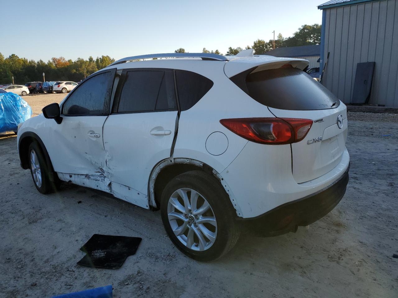 2015 Mazda CX-5 VIN JM3KE2DY8F0551945 Copart auction photo, side damage thumbnail 2