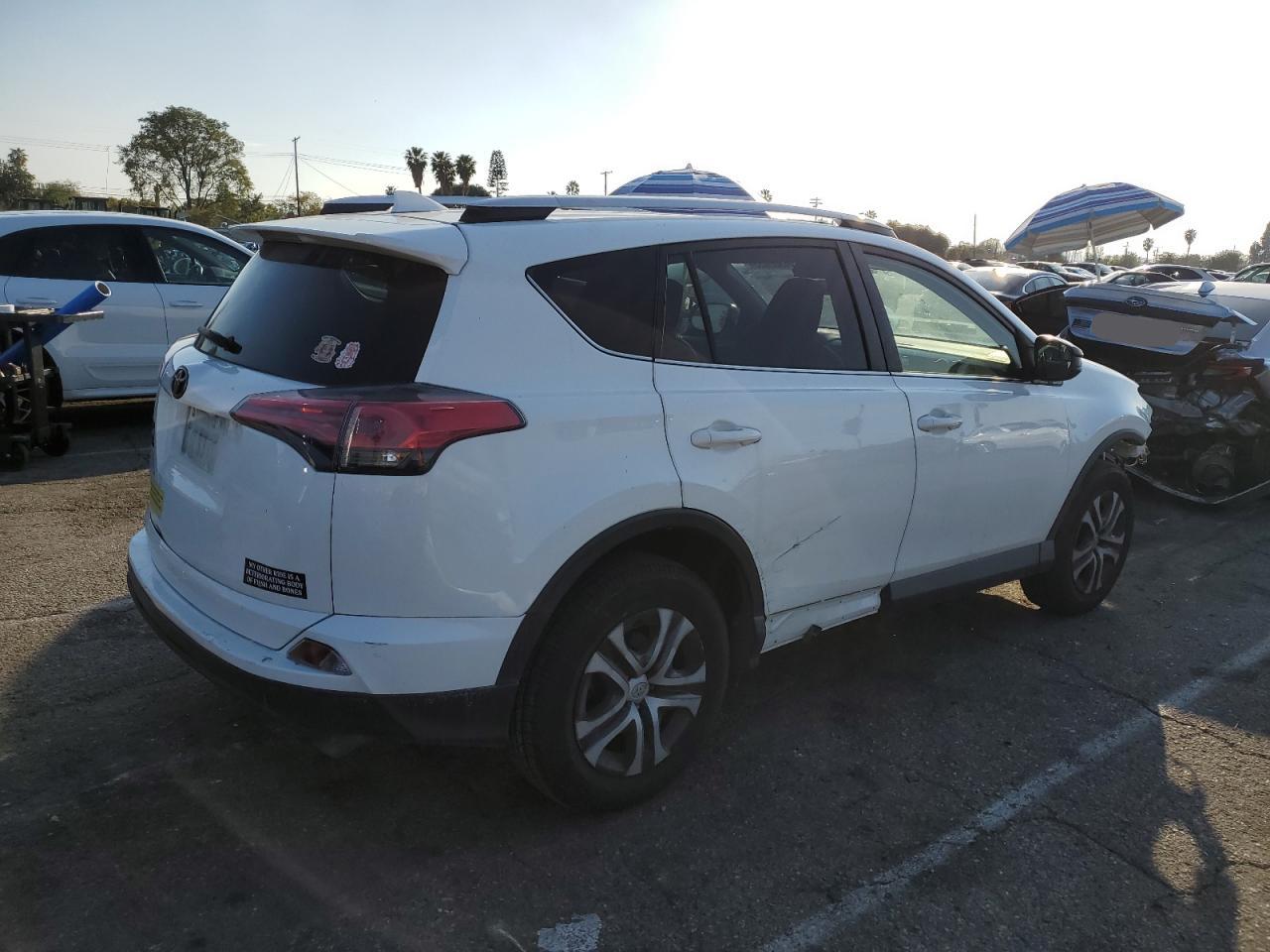 2016 Toyota RAV 4 VIN JTMZFREV2GJ076189 Copart auction photo, front end / minor dent/scratches damage thumbnail 3