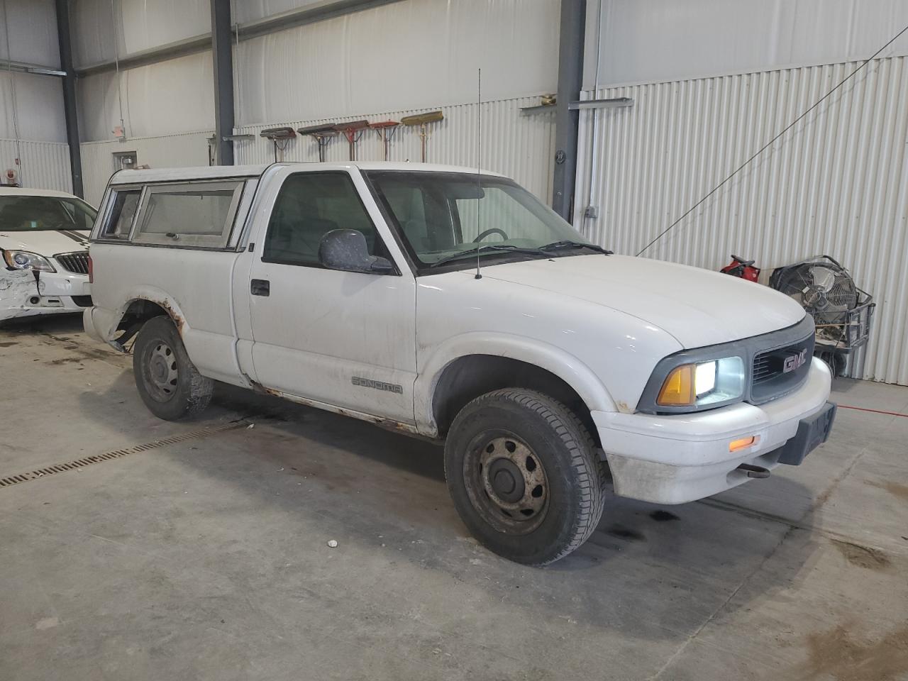 1997 GMC Sonoma VIN 1GTCT14X2VK514199 Copart auction photo, side / rear end damage thumbnail 4