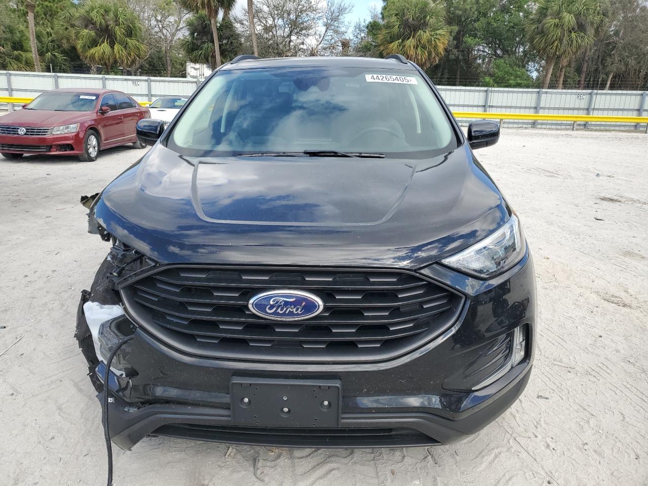 2023 Ford Edge VIN 2FMPK4J97PBA09778 Copart auction photo, front end / side damage thumbnail 5