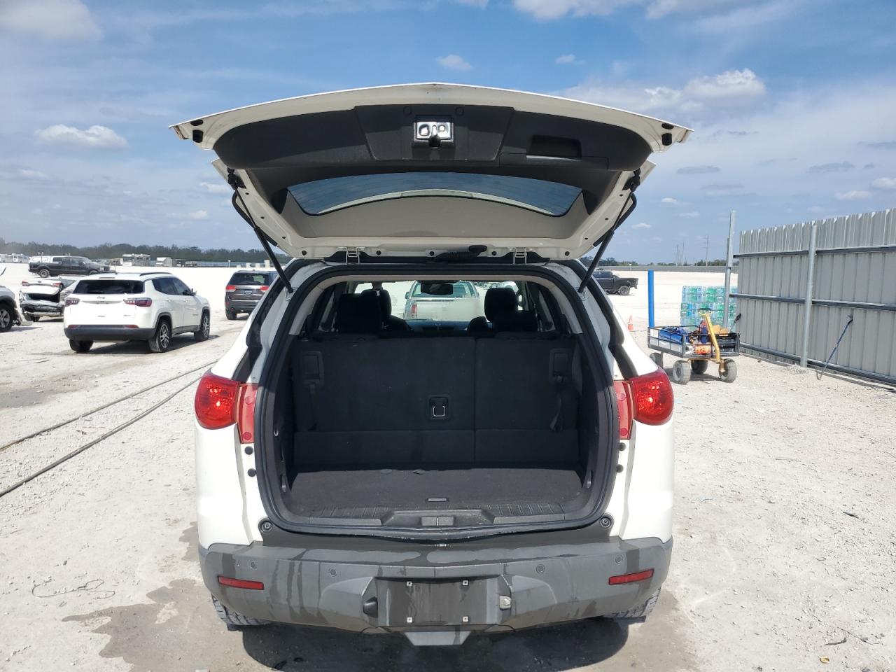 2012 Chevrolet Traverse VIN 1GNKRGED1CJ285381 Copart auction photo, side / rear end damage thumbnail 6