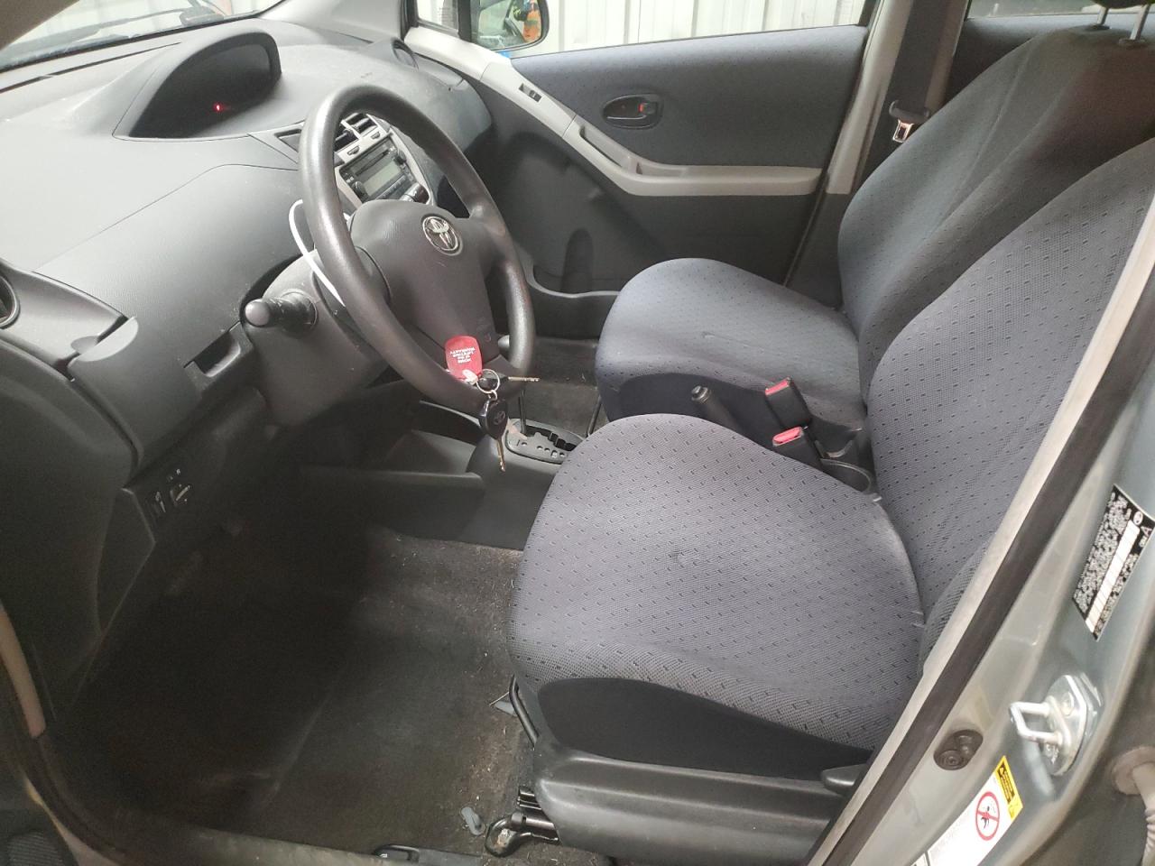 2009 Toyota Yaris VIN JTDKT903495239209 Copart auction photo, front end damage thumbnail 7