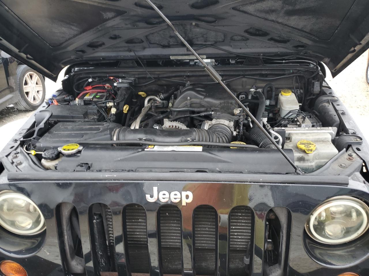 2012 Jeep Wrangler VIN 1C4BJWDG5CL181177 Copart auction photo, water/flood damage thumbnail 12