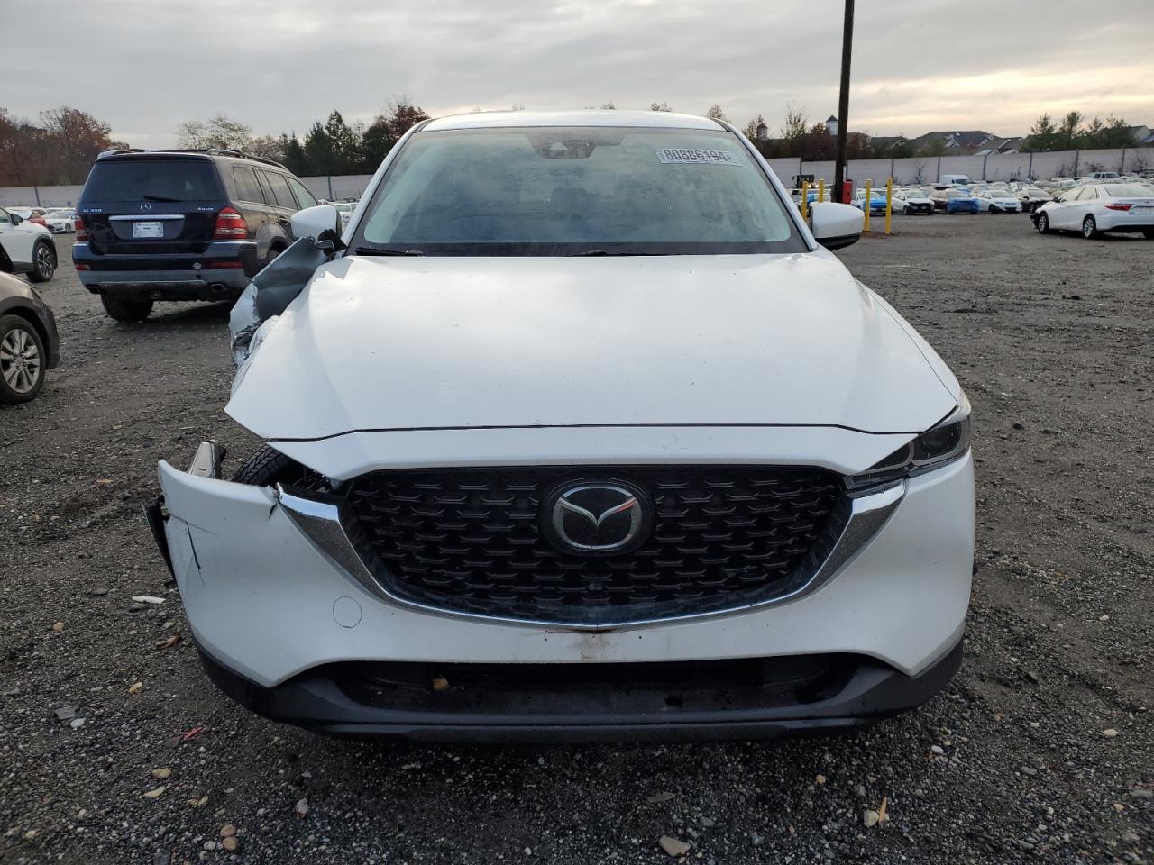 2022 Mazda CX-5 VIN JM3KFBBMXN0640587 Copart auction photo, undercarriage / front end damage thumbnail 5
