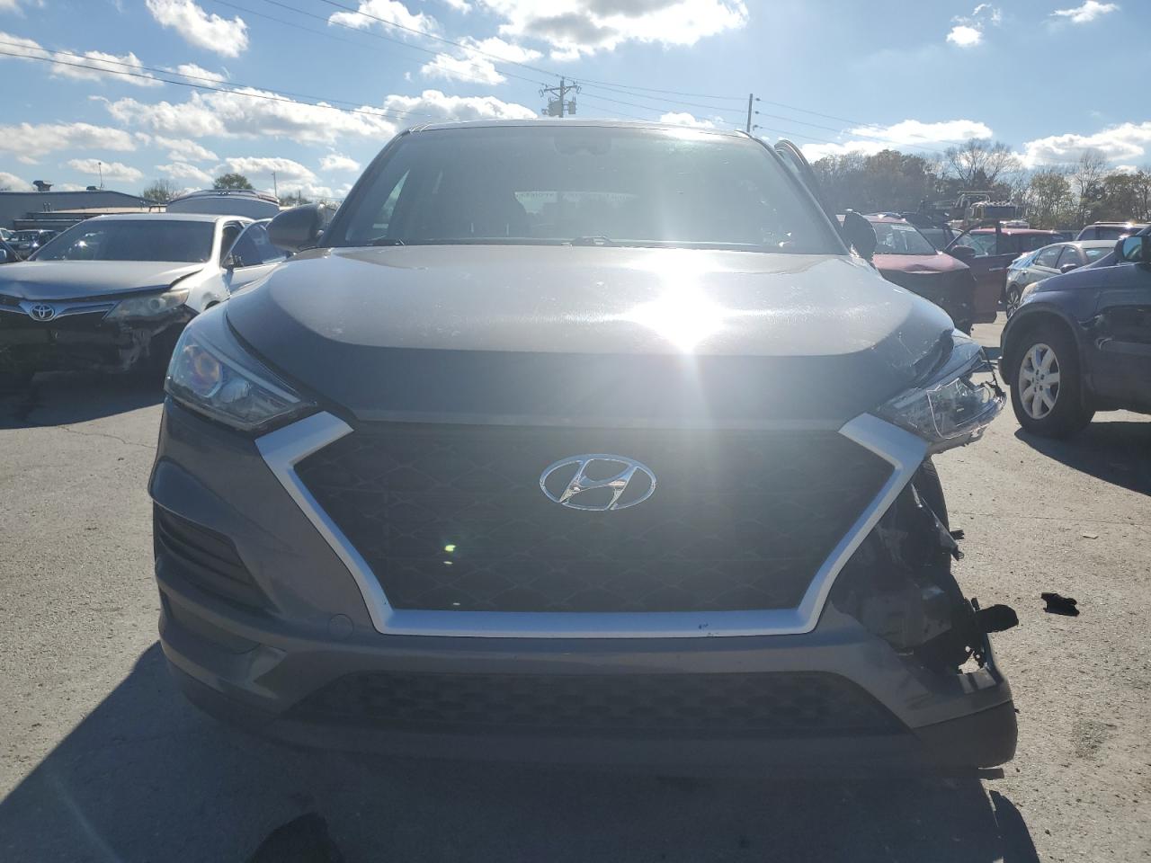 2021 Hyundai Tucson VIN KM8J23A41MU337885 Copart auction photo, front end / side damage thumbnail 5