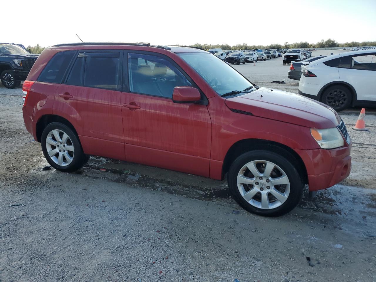 2011 Suzuki Grand Vitara VIN JS3TE0D75B4100095 Copart auction photo, side / front end damage thumbnail 4