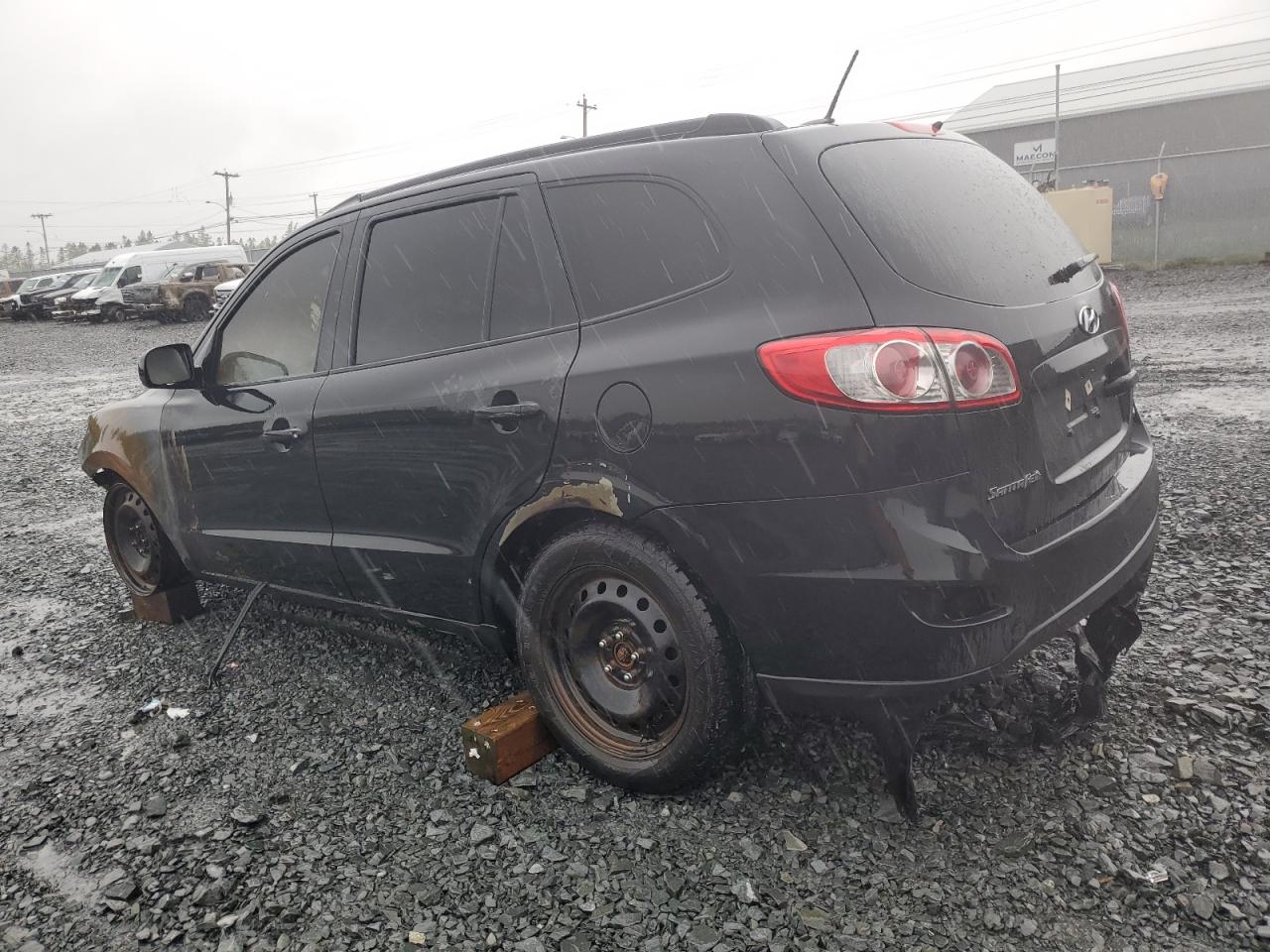 2012 Hyundai Santa Fe VIN 5XYZGDAB2CG151074 Copart auction photo, burn damage thumbnail 2