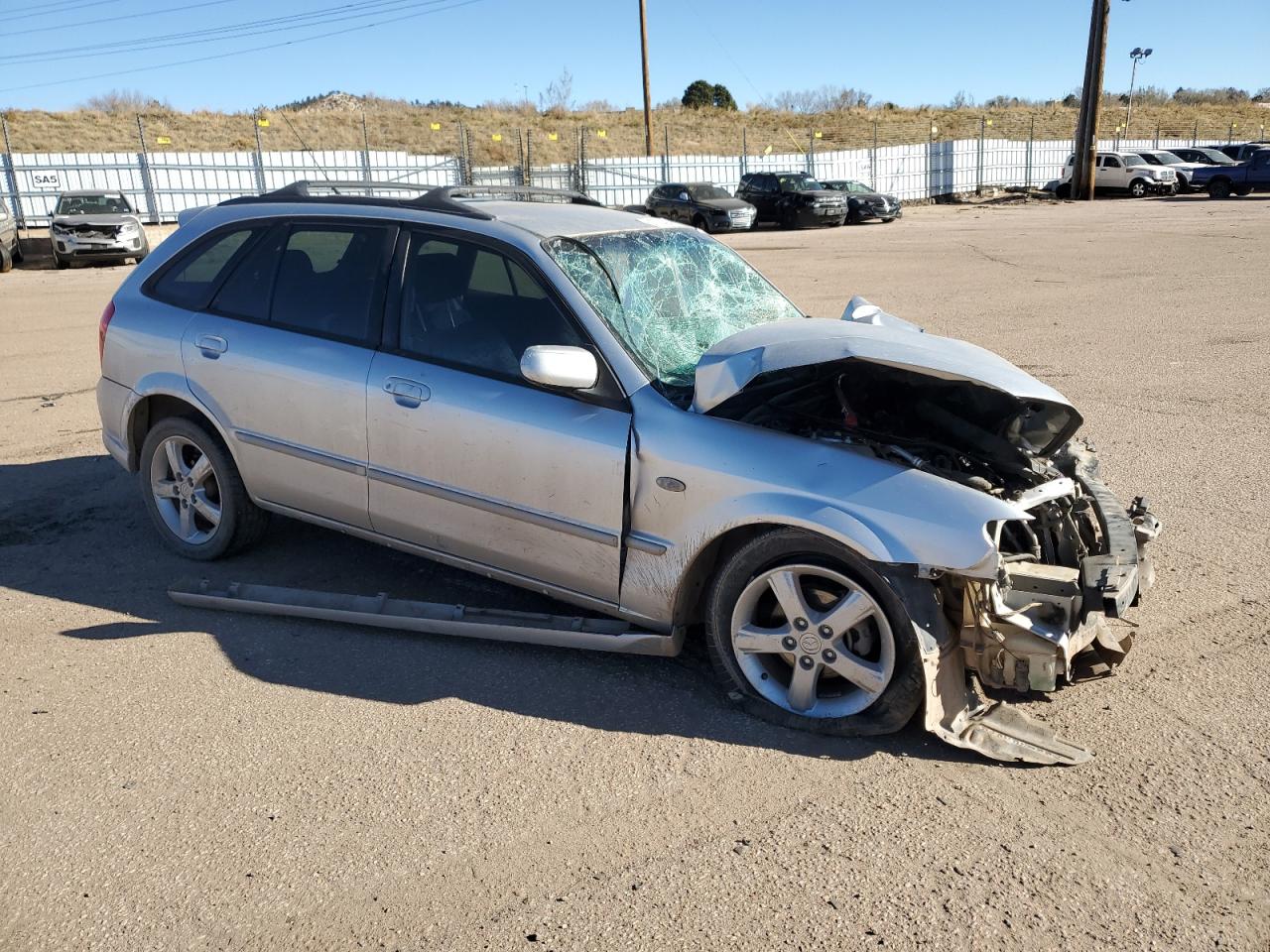2002 Mazda Protege VIN JM1BJ245X21631150 Copart auction photo, front end / side damage thumbnail 4