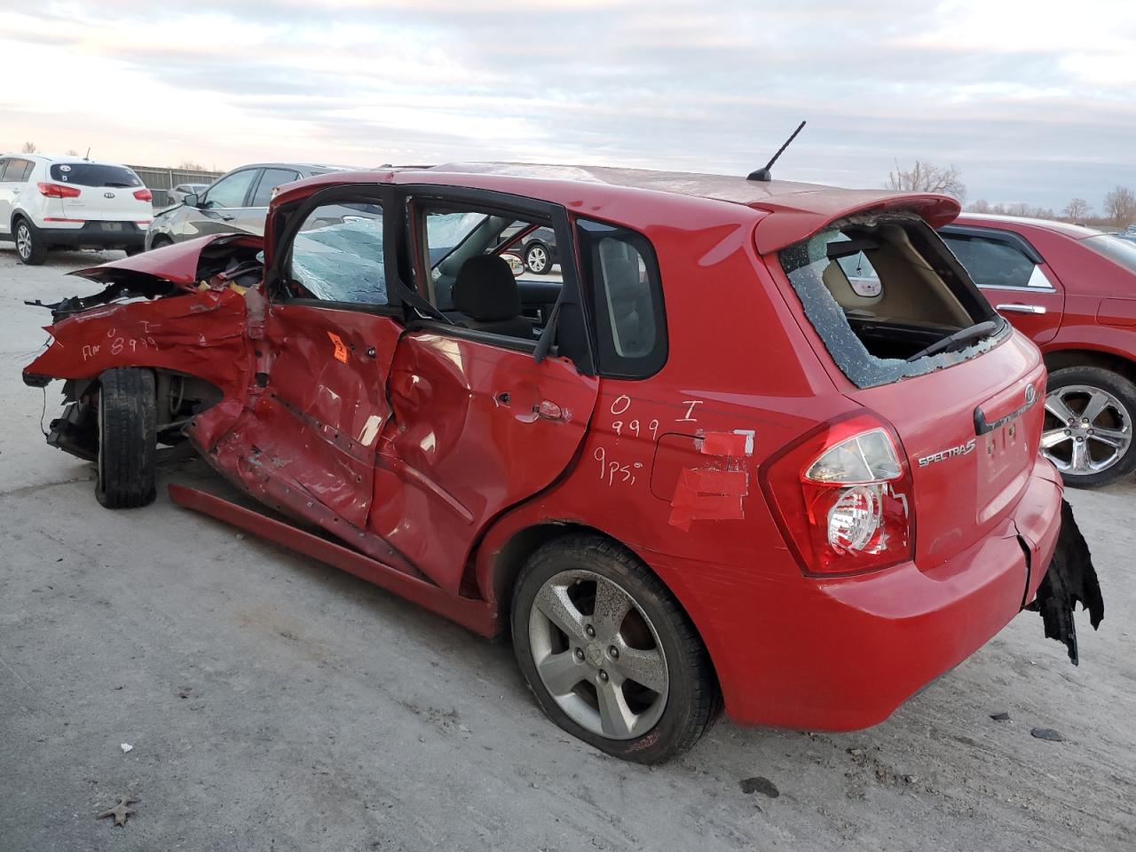 2009 KIA Spectra VIN KNAFE241295023187 Copart auction photo, all over damage thumbnail 2