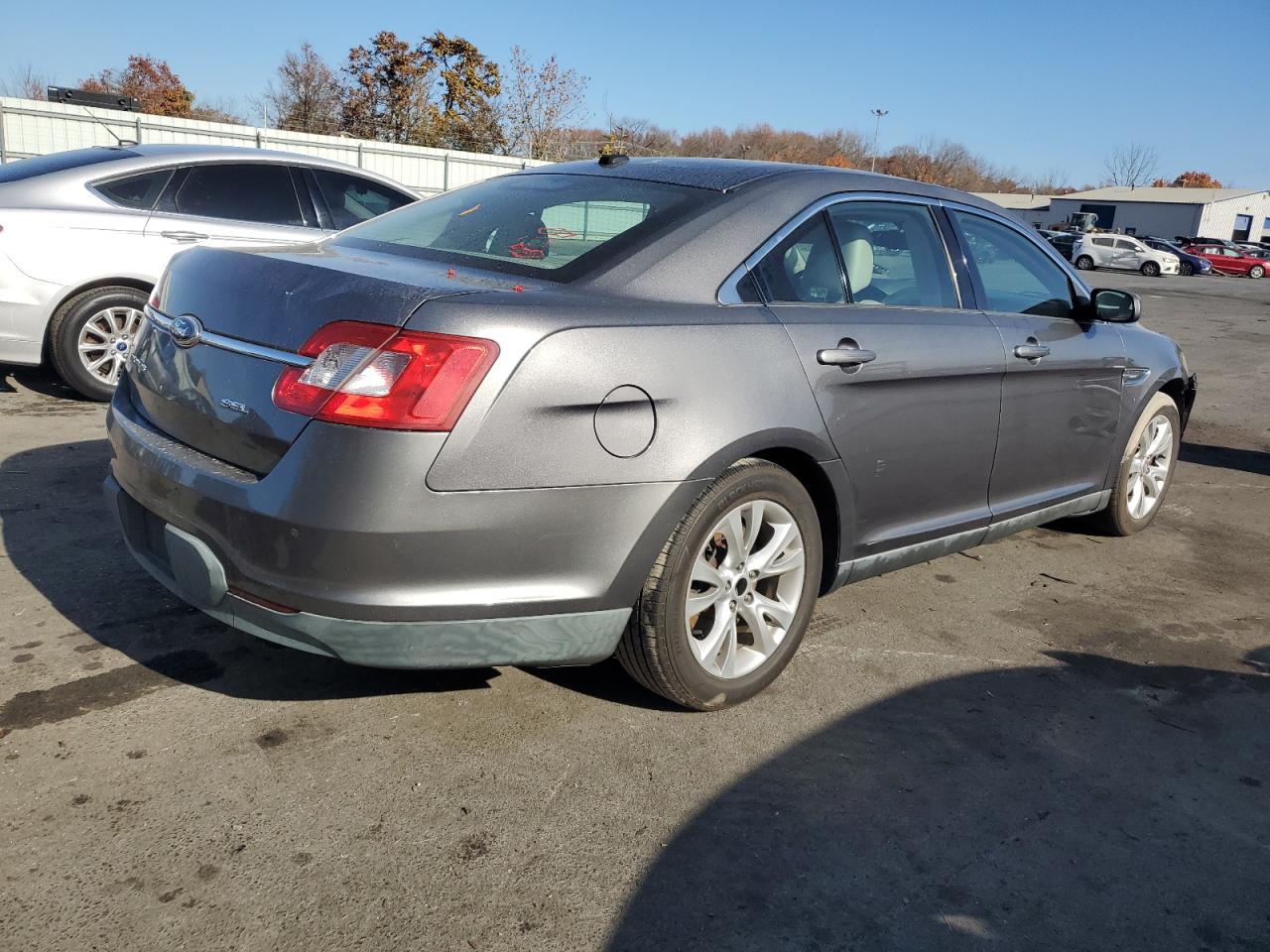 2011 Ford Taurus VIN 1FAHP2EW4BG113666 Copart auction photo, side damage thumbnail 3