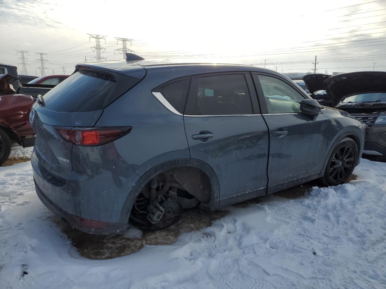 2021 Mazda CX-5 VIN JM3KFBCM0M0395988 Copart auction photo, undercarriage / minor dent/scratches damage thumbnail 3