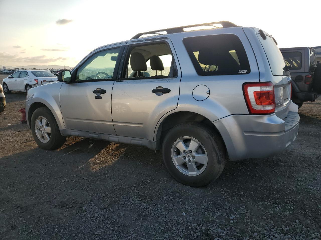 2010 Ford Escape VIN 1FMCU0D76AKB81390 Copart auction photo, vandalism damage thumbnail 2