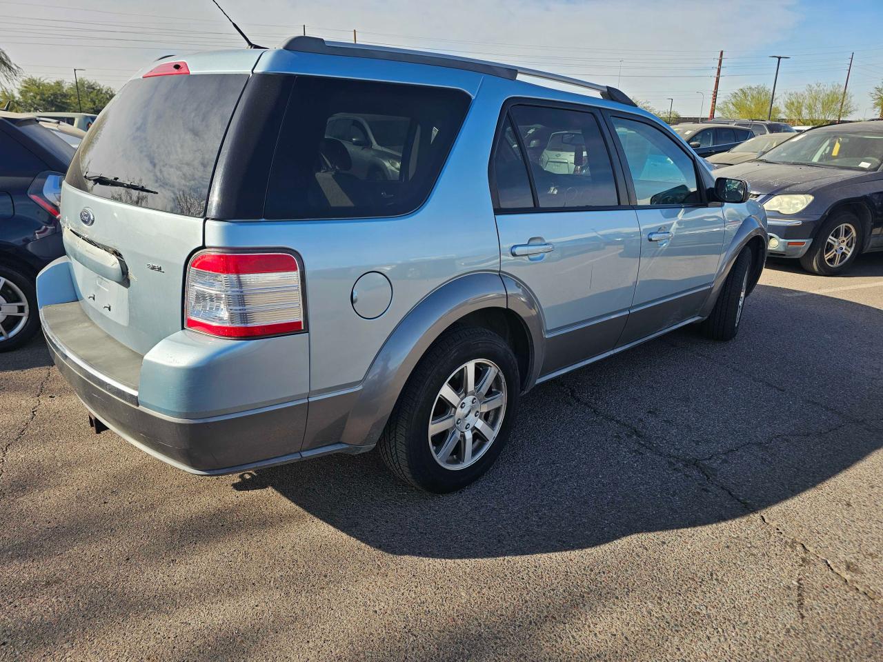 2009 Ford Taurus VIN 1FMDK02W49GA02153 Copart auction photo, minor dent/scratches / normal wear damage thumbnail 4