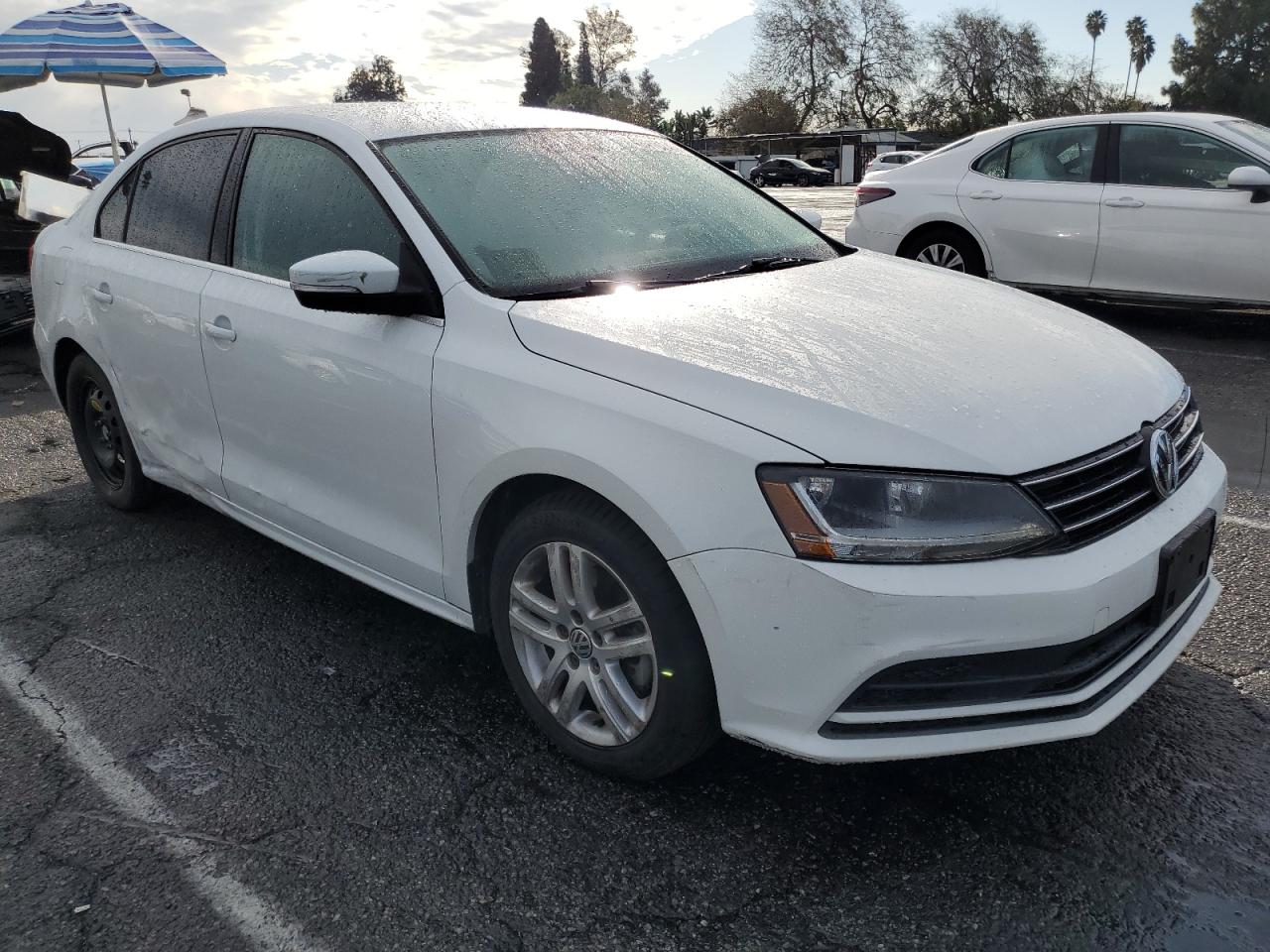 2017 Volkswagen Jetta VIN 3VW2B7AJ5HM263562 Copart auction photo, side / rear end damage thumbnail 4
