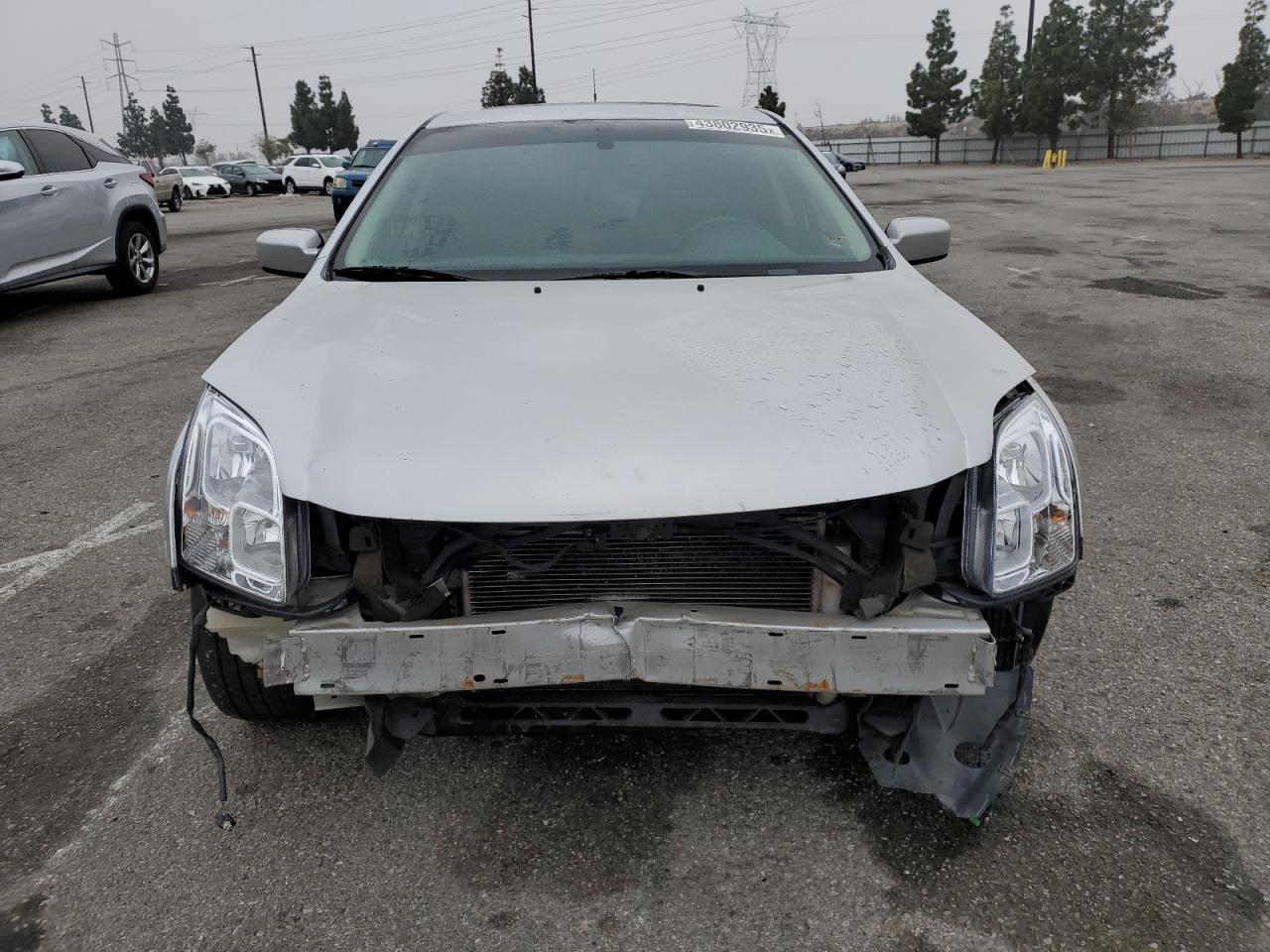 2009 Ford Fusion VIN 3FAHP07Z69R155562 Copart auction photo, front end / side damage thumbnail 5