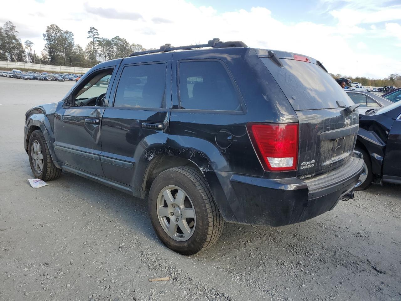 2009 Jeep Grand Cherokee VIN 1J8GR48K19C529950 Copart auction photo, side / front end damage thumbnail 2