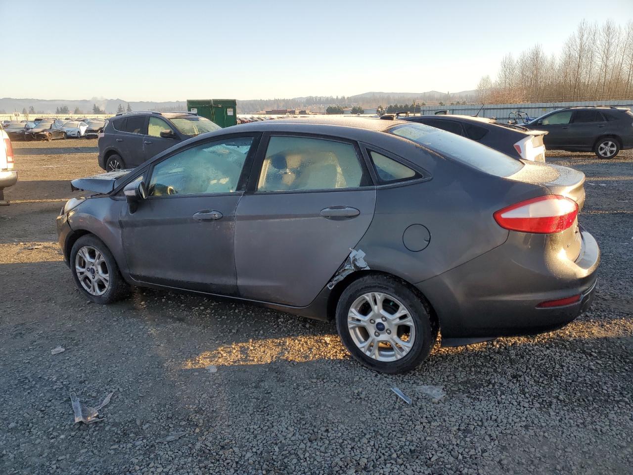 2015 Ford Fiesta VIN 3FADP4BJXFM214127 Copart auction photo, front end / side damage thumbnail 2