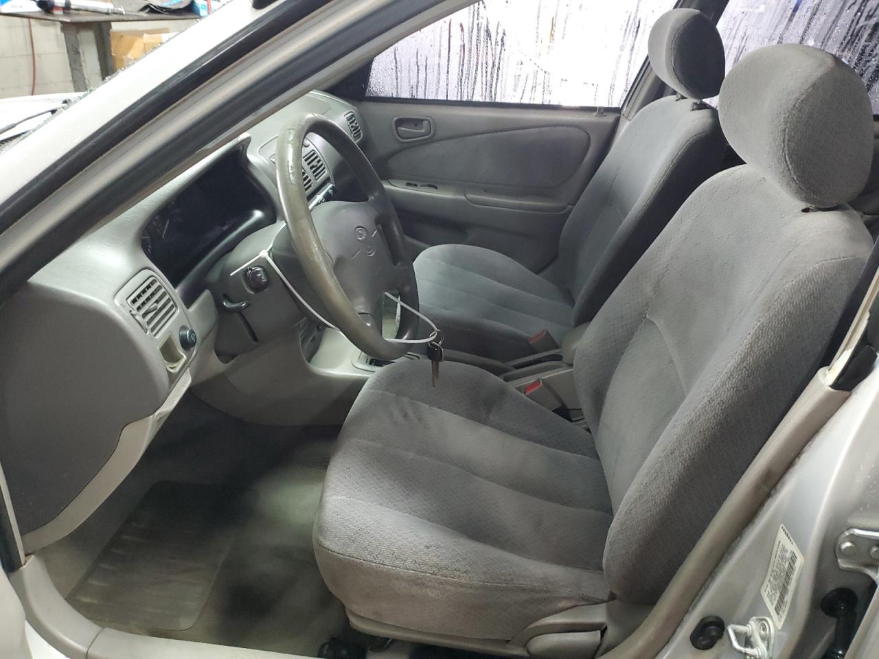 2000 Toyota Corolla VIN 1NXBR12E2YZ352302 Copart auction photo, front end / hail damage thumbnail 7