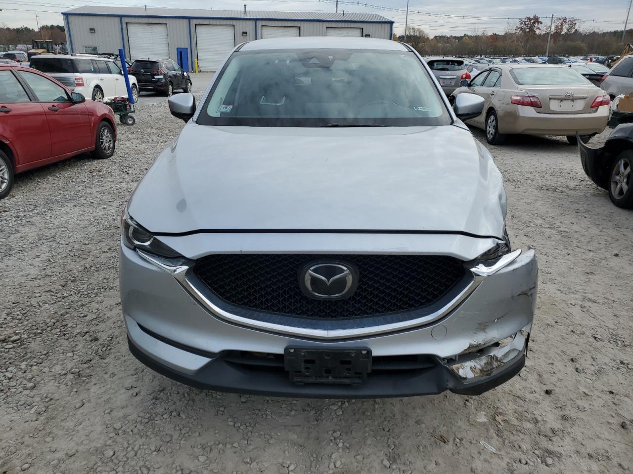 2021 Mazda CX-5 VIN JM3KFBCM6M0345869 Copart auction photo, front end / undercarriage damage thumbnail 5