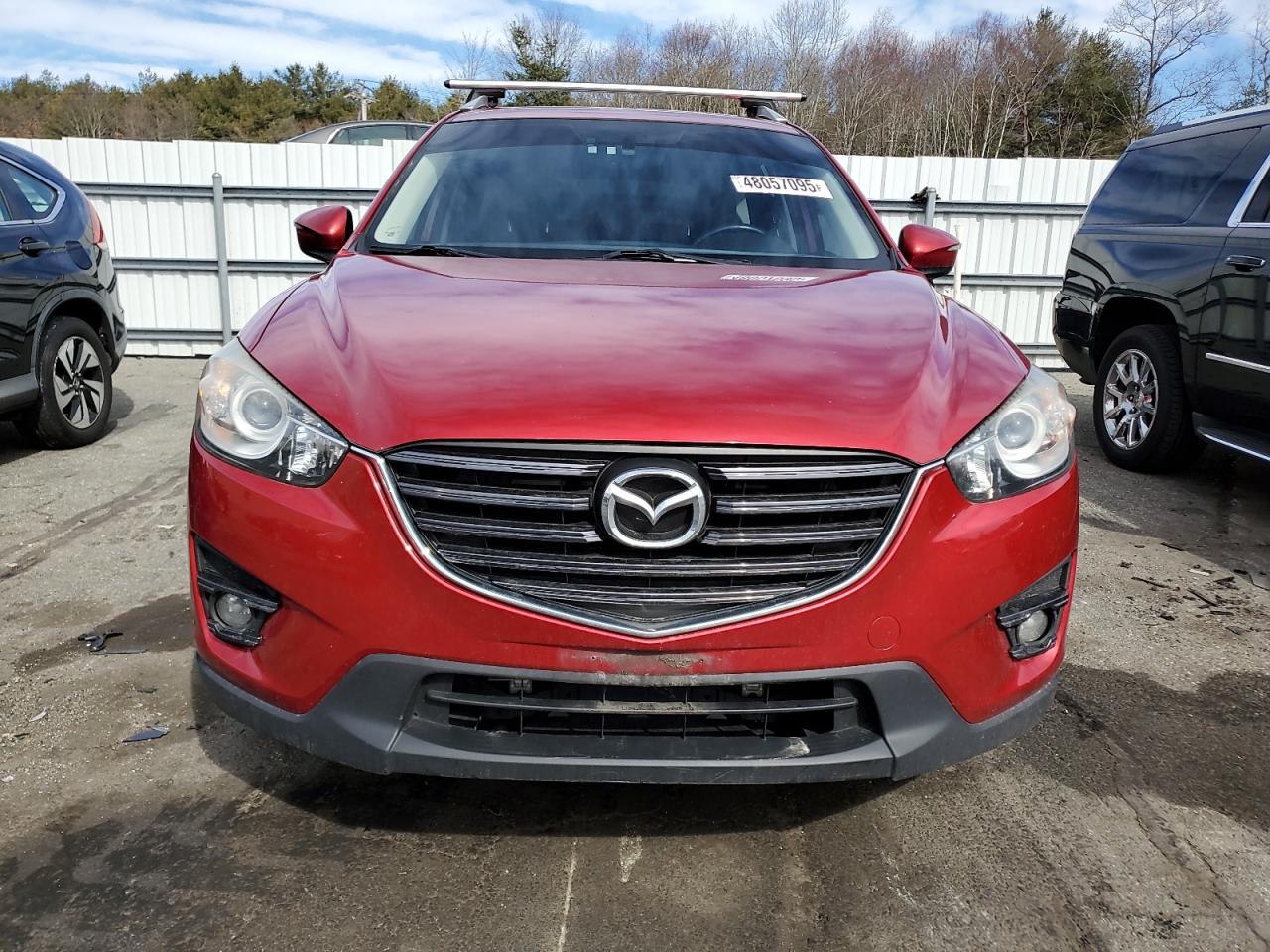 2016 Mazda CX-5 VIN JM3KE4DY1G0753118 Copart auction photo, side / front end damage thumbnail 5