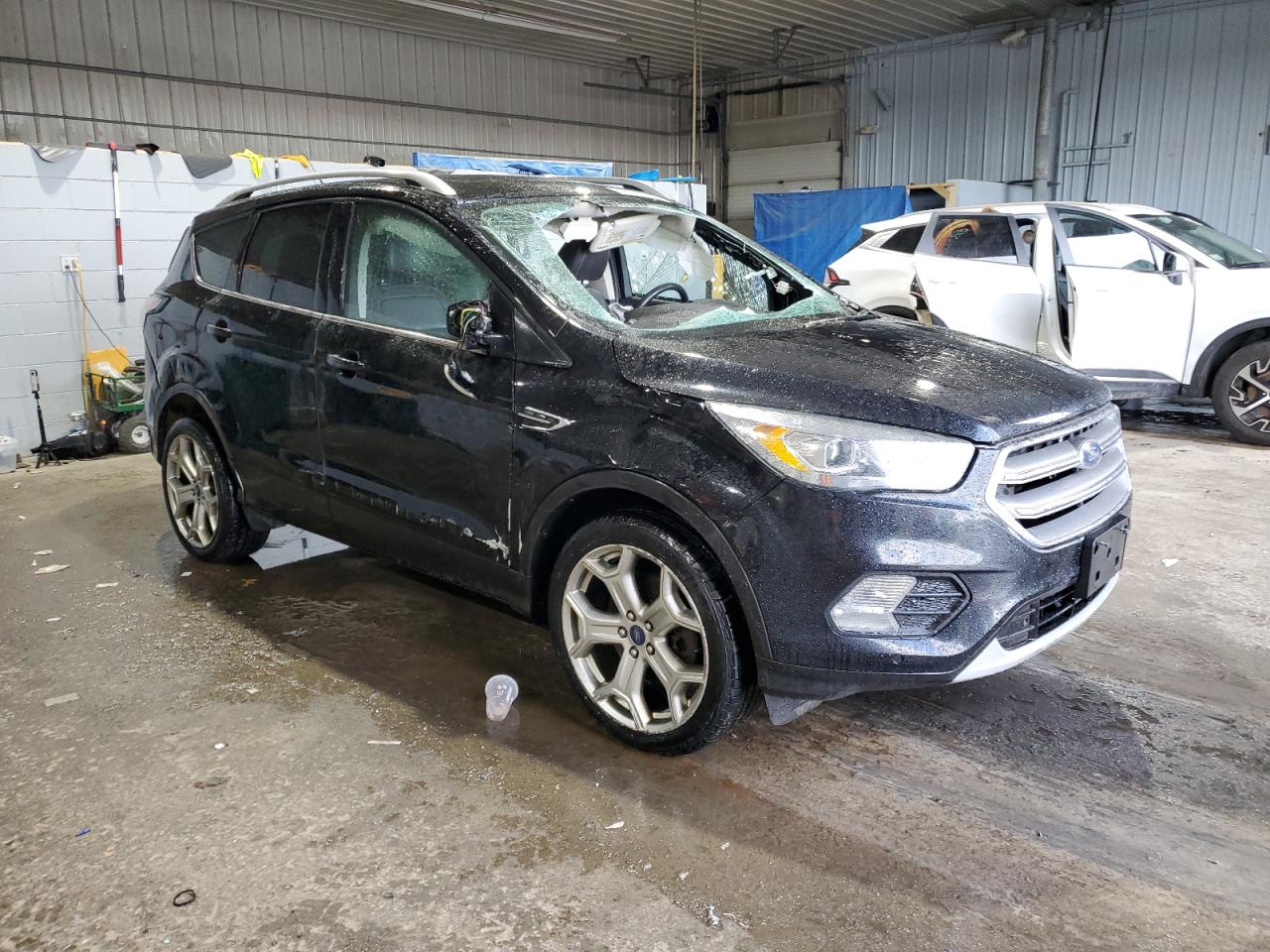 2017 Ford Escape VIN 1FMCU9J98HUC05746 Copart auction photo, rollover / side damage thumbnail 4