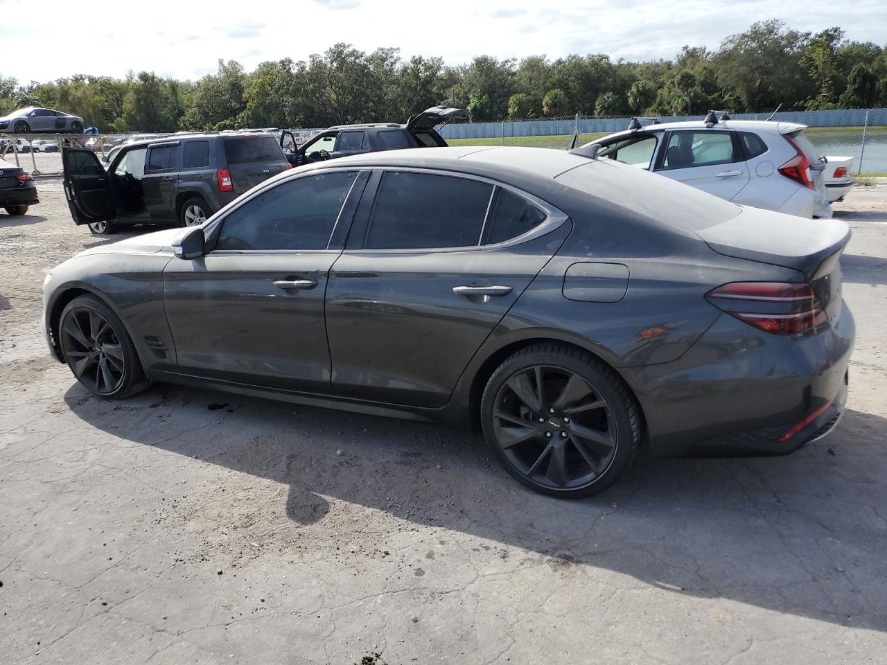 2023 Genesis G70 VIN KMTG34TA4PU104352 Copart auction photo, water/flood damage thumbnail 2