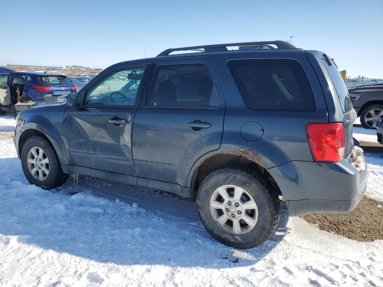 2010 Mazda Tribute VIN 4F2CY9GG1AKM06002 Copart auction photo, side / minor dent/scratches damage thumbnail 2