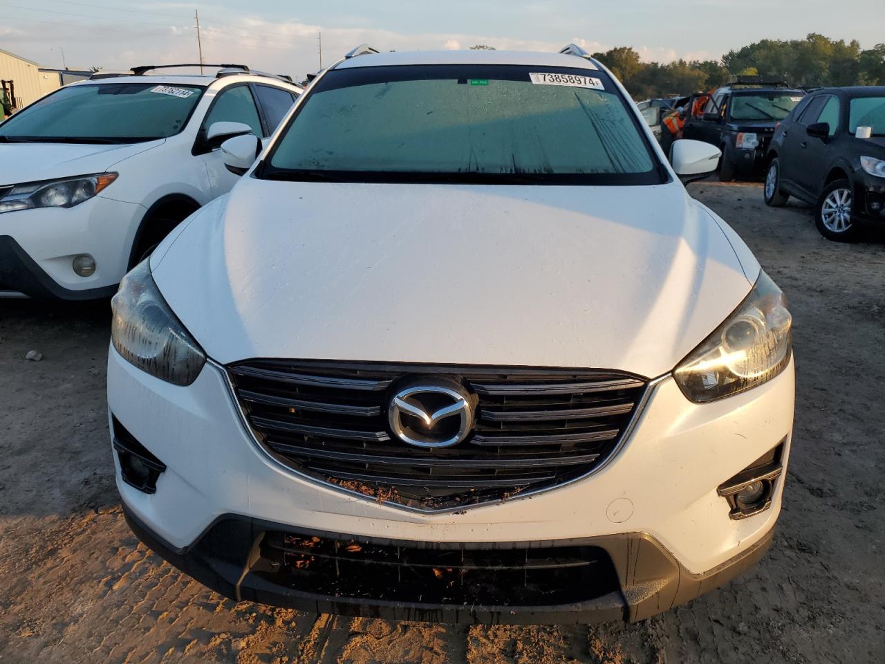 2016 Mazda CX-5 VIN JM3KE2CYXG0812401 Copart auction photo, water/flood damage thumbnail 5