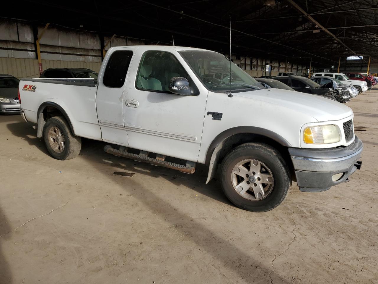 2002 Ford F-150 VIN 1FTRX18L72NA19576 Copart auction photo, rear end / minor dent/scratches damage thumbnail 4