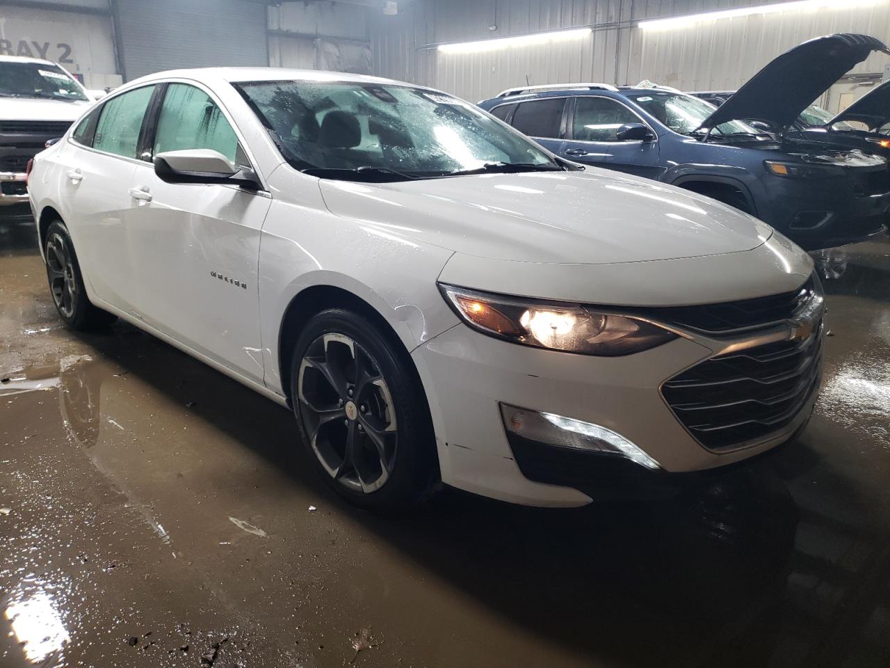 2022 Chevrolet Malibu VIN 1G1ZD5ST0NF137565 Copart auction photo, rear end / minor dent/scratches damage thumbnail 4