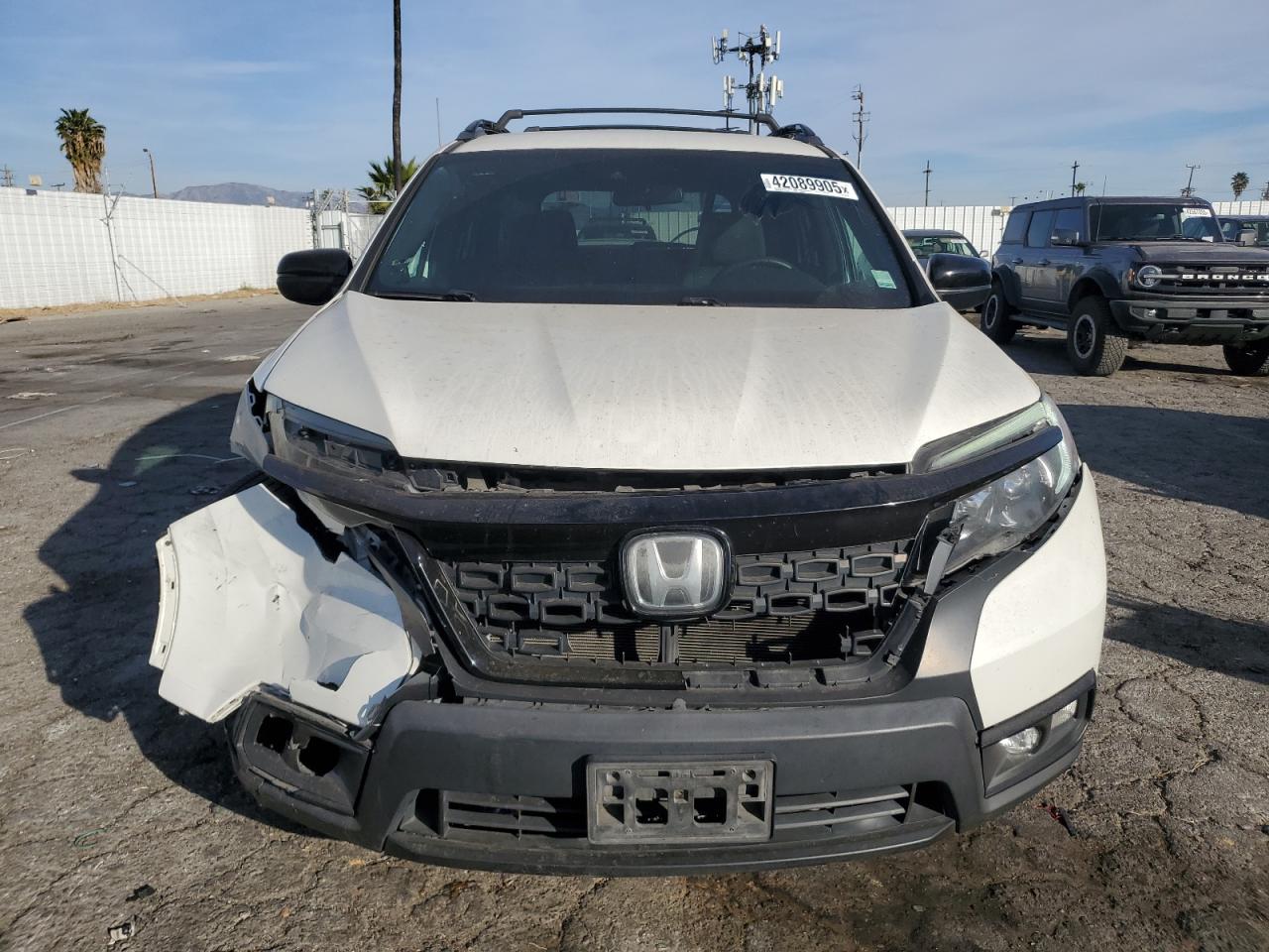 2019 Honda Passport VIN 5FNYF8H22KB016128 Copart auction photo, undercarriage / front end damage thumbnail 5