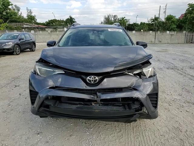 2017 Toyota RAV 4 VIN JTMZFREV1HJ115632 Copart auction photo, front end / minor dent/scratches damage thumbnail 14