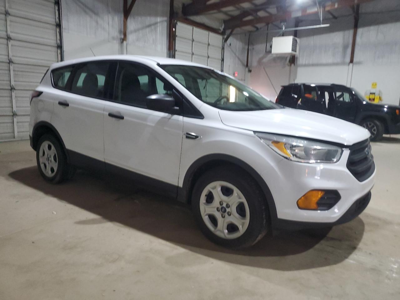 2017 Ford Escape VIN 1FMCU0F7XHUD82804 Copart auction photo, all over damage thumbnail 4