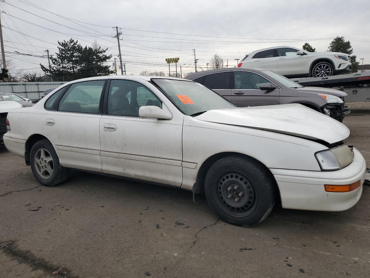 1997 Toyota Avalon VIN 4T1BF12B5VU139340 Copart auction photo, all over / undercarriage damage thumbnail 4