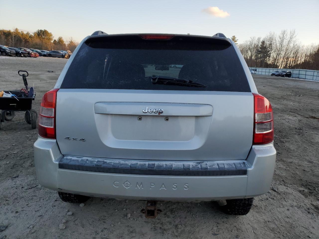 2010 Jeep Compass VIN 1J4NF4FB8AD601410 Copart auction photo, side / front end damage thumbnail 6