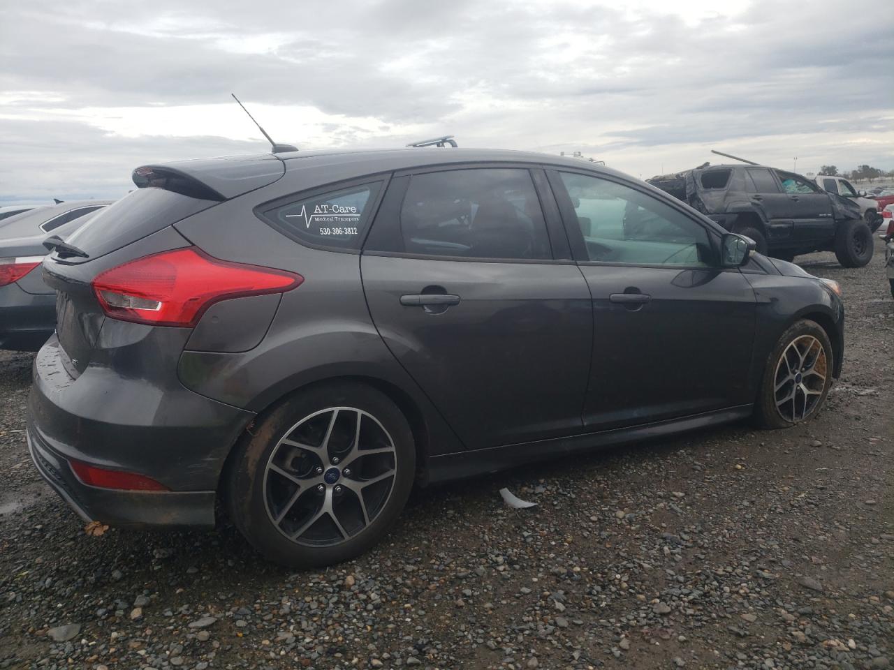 2015 Ford Focus VIN 1FADP3K2XFL380460 Copart auction photo, side / front end damage thumbnail 3
