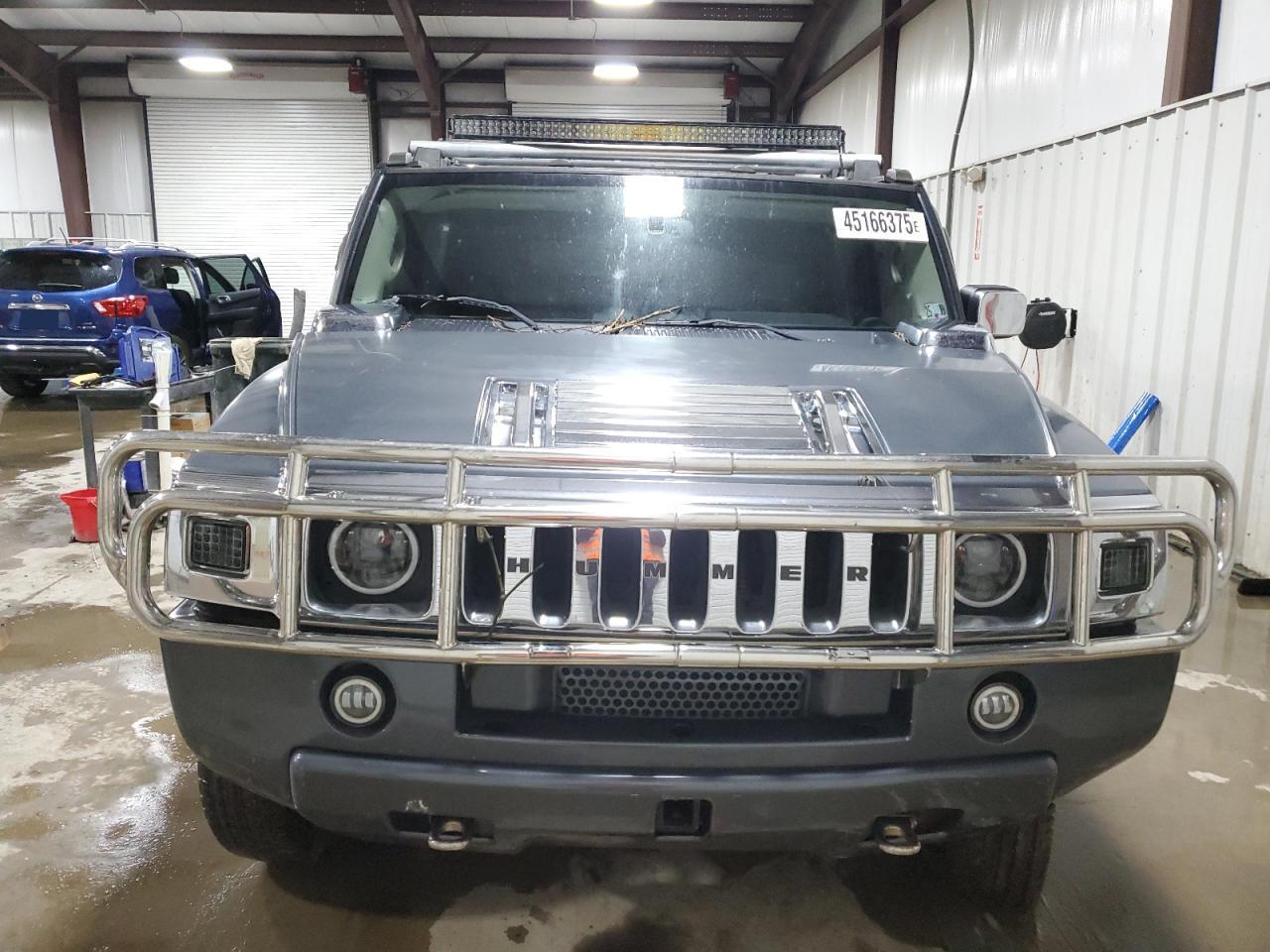 2003 Hummer H2 VIN 5GRGN23U73H127407 Copart auction photo, side / rear end damage thumbnail 5