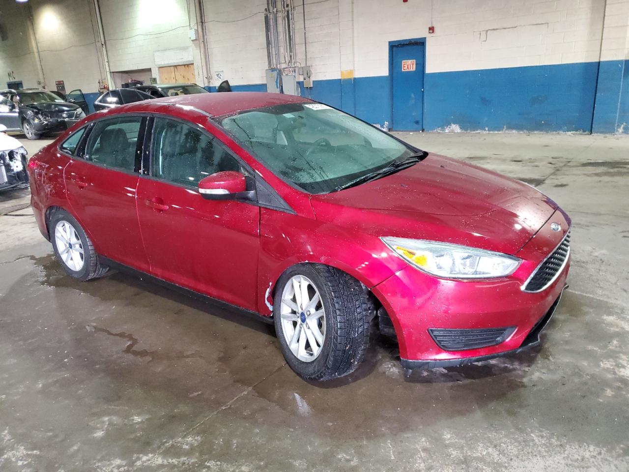 2016 Ford Focus VIN 1FADP3F2XGL261576 Copart auction photo, side / undercarriage damage thumbnail 4