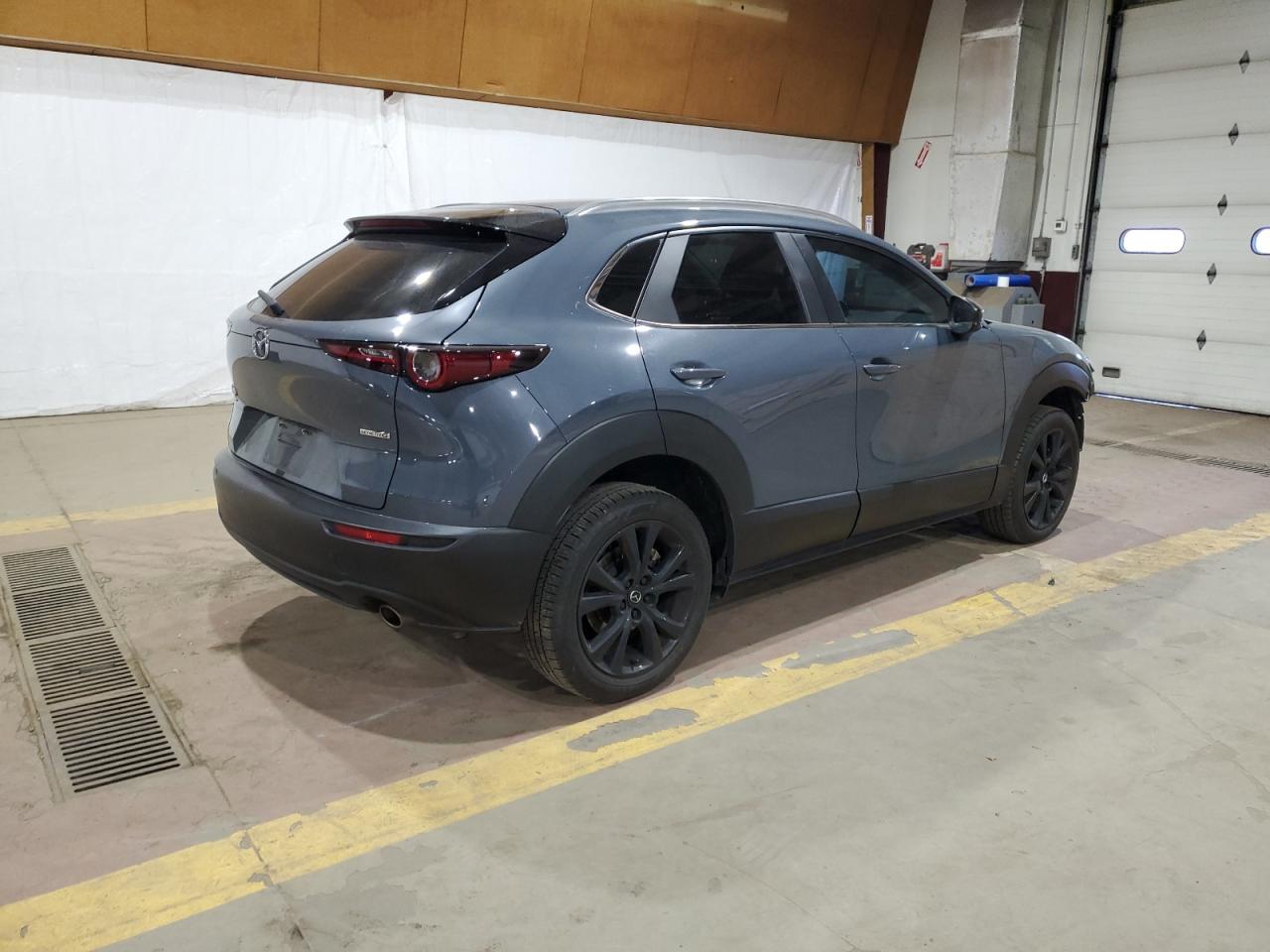 2022 Mazda CX-30 VIN 3MVDMBCL2NM445298 Copart auction photo, front end / side damage thumbnail 3